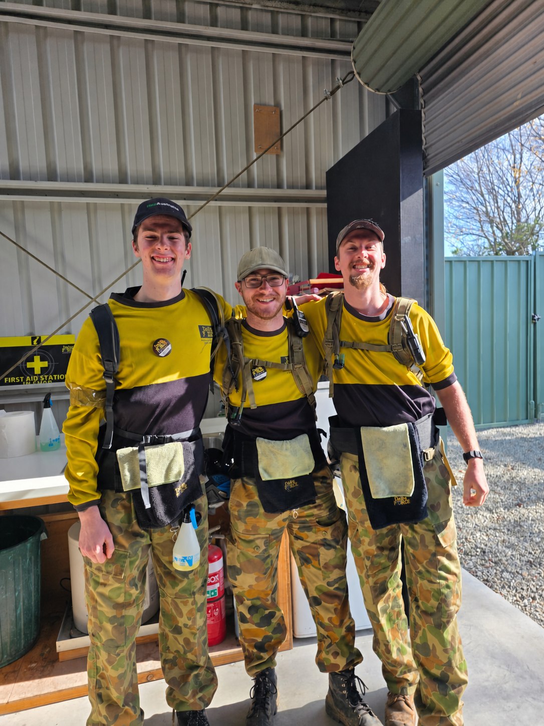 Three smiling Delta Force marshals ready to welcome groups