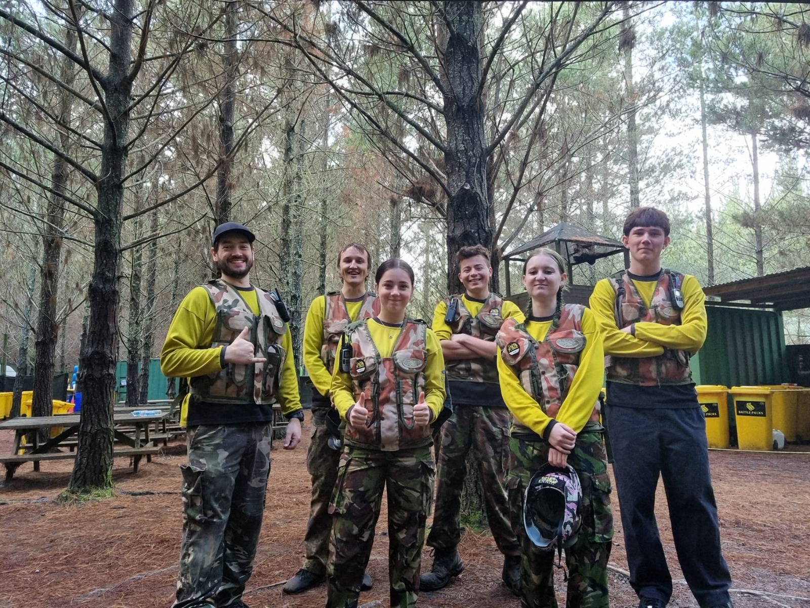A six-person Delta Force marshal team in woodland surroundings